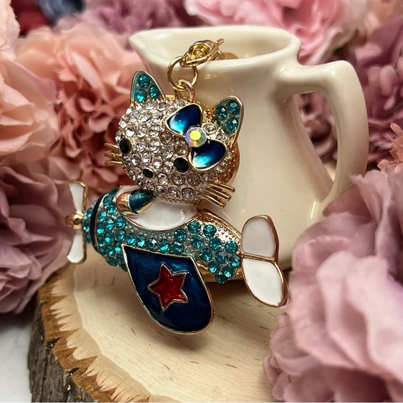 Hello Kitty Flying a Bkue Crystal Airplane Keychain Charm - Picture 7 of 16